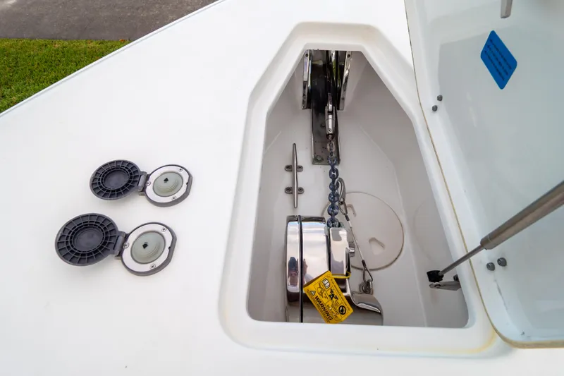 Slide: The Image of 2021 Sea Hunt Gamefish 27 helm with dual displays and modern controls. - 21