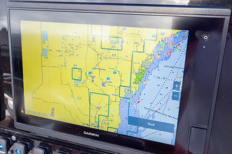 Slide: The Image of Garmin navigation display on 2021 Sea Hunt Gamefish 27 boat, showing detailed marine chart. - 25