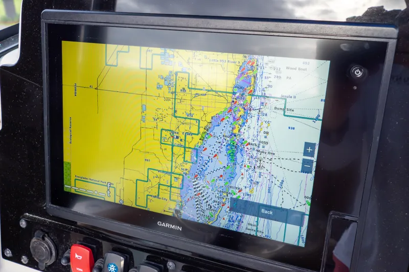 Slide: The Image of 2021 Sea Hunt Gamefish 27 boat controls with safety lanyard and warning label. - 26