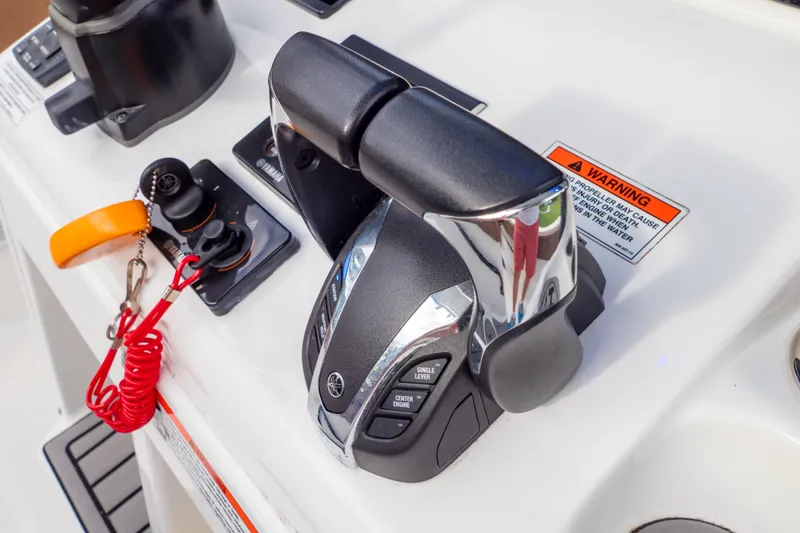 Slide: The Image of Control panel of 2021 Sea Hunt Gamefish 27 boat with switches and Garmin display. - 27