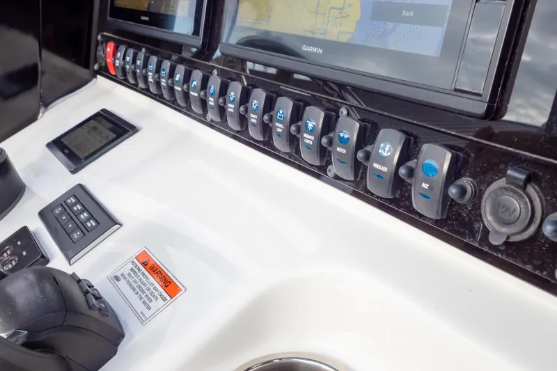 Slide: The Image of Yamaha controls on 2021 Sea Hunt Gamefish 27 boat dashboard. - 28
