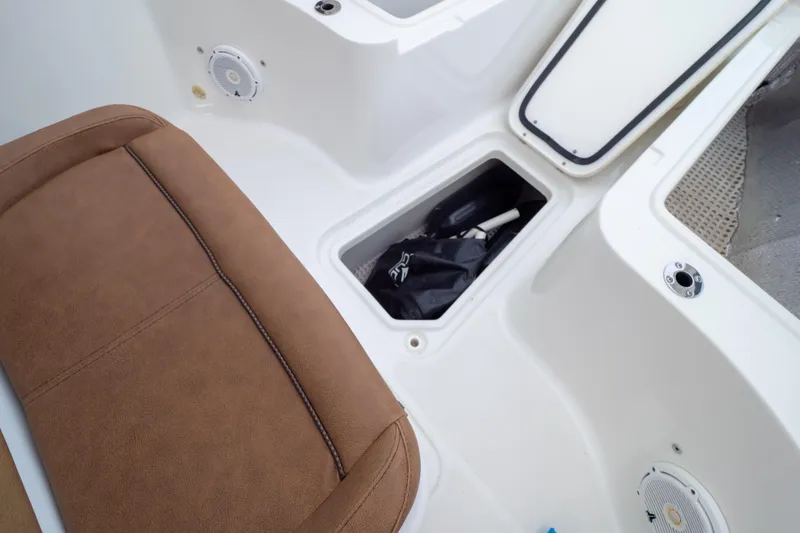 Slide: The Image of 2021 Sea Hunt Gamefish 27 Forward Seating with brown cushions, showcasing spacious and comfortable design. - 40
