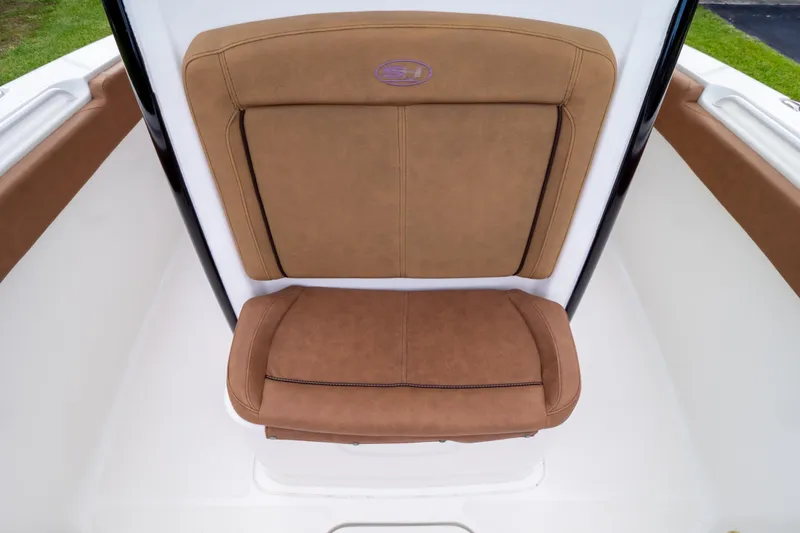Slide: The Image of 2021 Sea Hunt Gamefish 27 Forward Seating with brown cushions and cup holders. - 42