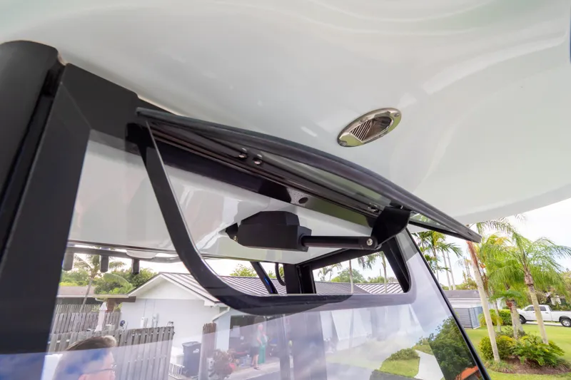 Slide: The Image of 2021 Sea Hunt Gamefish 27 Forward Seating windshield wiper detail with tropical background. - 45