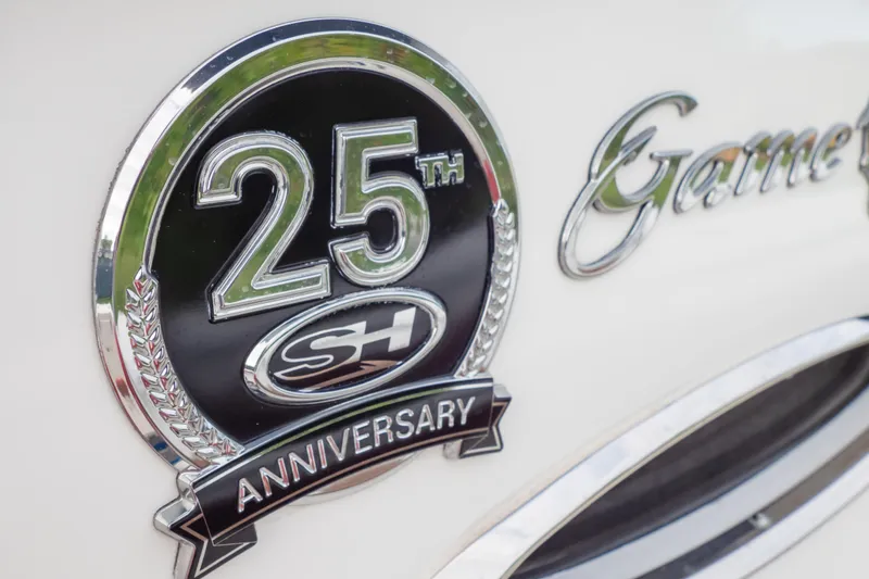 Slide: The Image of 25th Anniversary badge on 2021 Sea Hunt Gamefish 27 Forward Seating boat. - 46