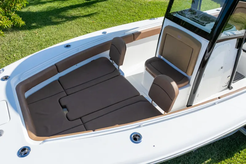 Slide: The Image of 2021 Sea Hunt Gamefish 27 boat with forward seating and brown cushions. - 57