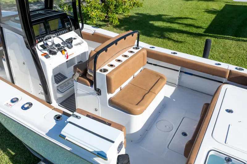 Slide: The Image of 2021 Sea Hunt Gamefish 27 boat interior with forward seating and modern controls. - 59