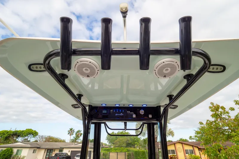 Slide: The Image of 2021 Sea Hunt Gamefish 27 boat's T-top with rod holders and speakers. - 60