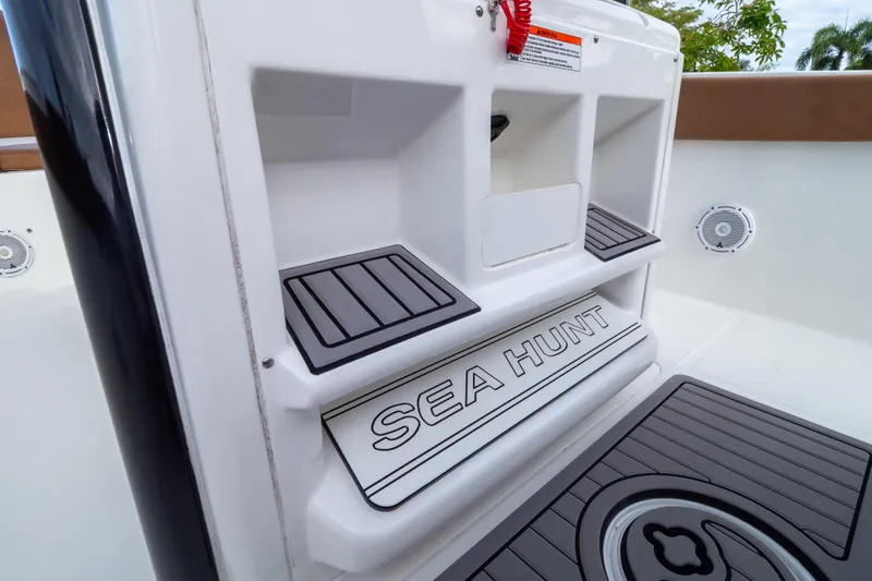 Slide: The Image of 2021 Sea Hunt Gamefish 27 Forward Seating boat interior with branded step detail. - 65