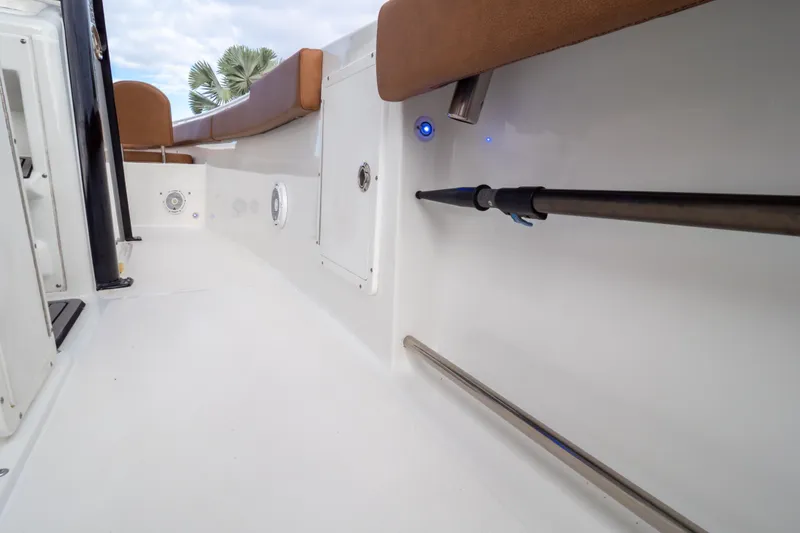 Slide: The Image of 2021 Sea Hunt Gamefish 27 boat with brown leather seating and white deck. - 71