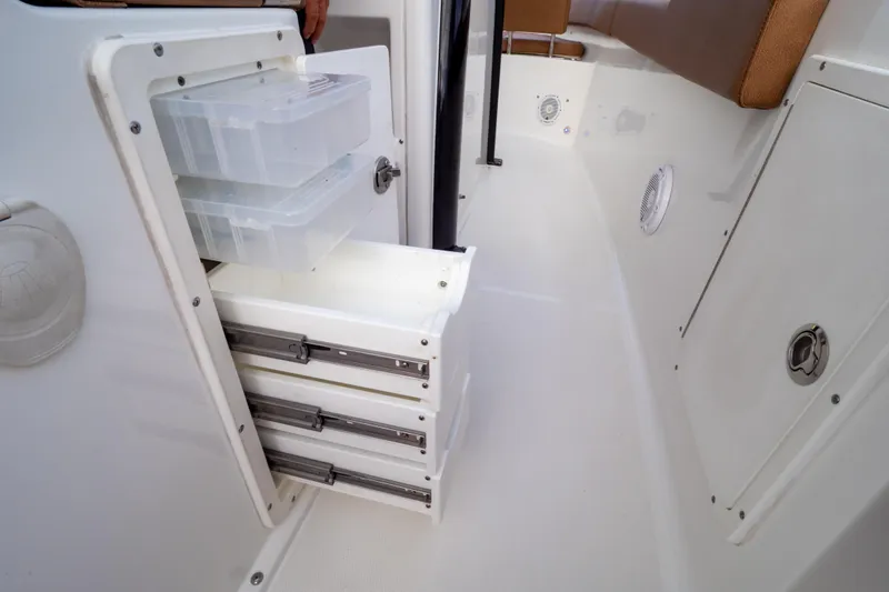 Slide: The Image of 2021 Sea Hunt Gamefish 27 boat on trailer, featuring forward seating and twin engines. - 84