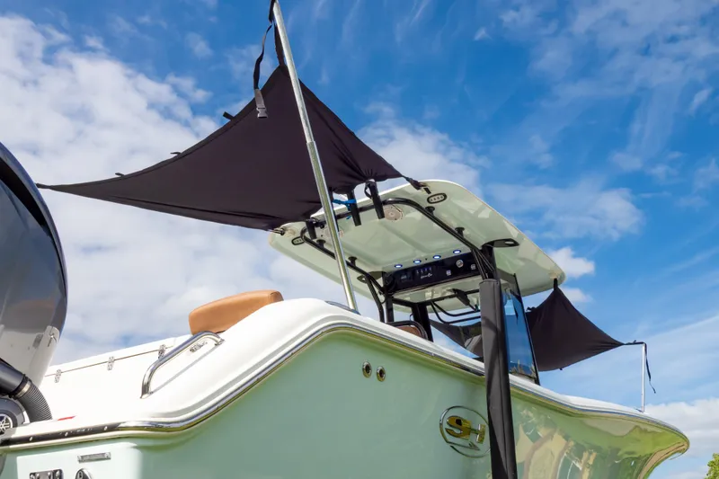 Slide: The Image of 2021 Sea Hunt Gamefish 27 boat interior with brown seating and stainless steel fittings. - 95