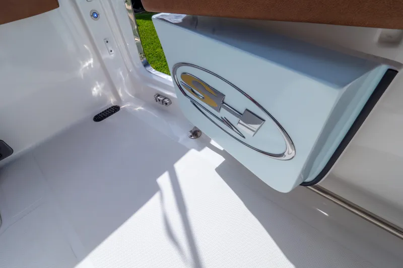 Slide: The Image of 2021 Sea Hunt Gamefish 27 boat interior with forward seating and storage compartment. - 96