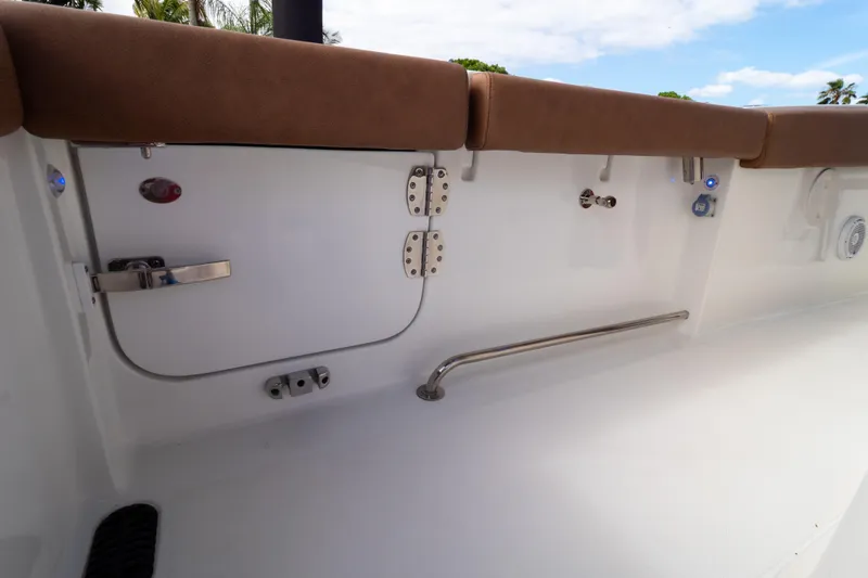 Slide: The Image of 2021 Sea Hunt Gamefish 27 boat with dual engines and brown seating. - 98