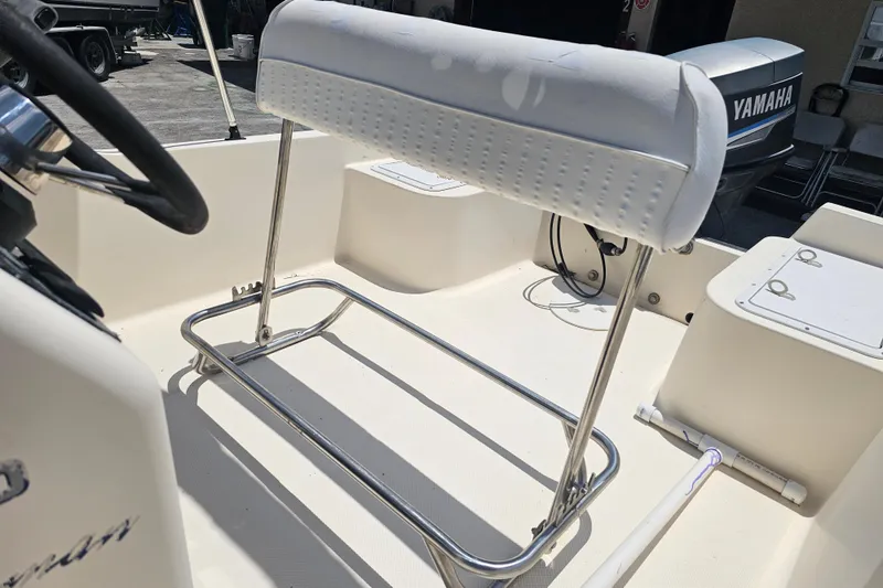 Slide: The Image of 2003 Key West 1720 Sportsman boat interior with steering wheel and Yamaha engine. - 10