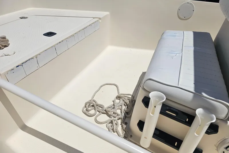 Slide: The Image of Interior of a 2003 Key West 1720 Sportsman boat with seating and rope. - 11