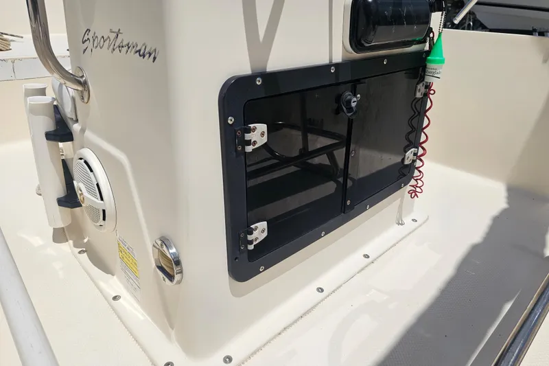 Slide: The Image of 2003 Key West 1720 Sportsman boat interior with storage compartment and speaker. - 15