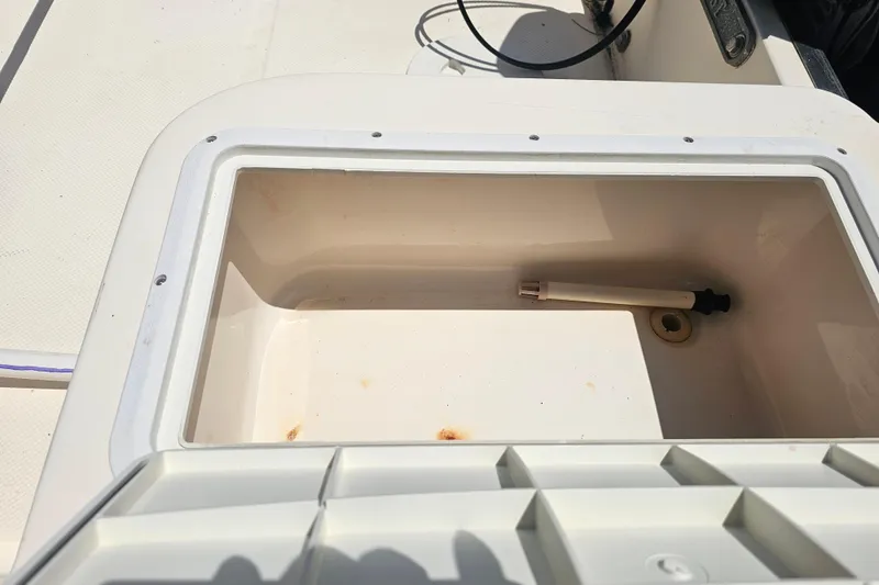 Slide: The Image of Open storage compartment on 2003 Key West 1720 Sportsman boat, showing interior details. - 16