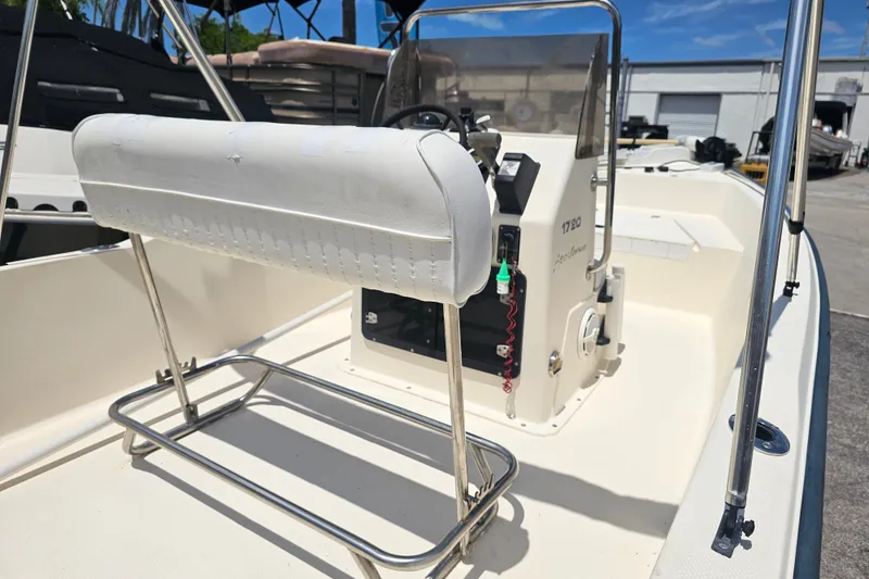 Slide: The Image of 2003 Key West 1720 Sportsman boat interior with console and seating. - 19