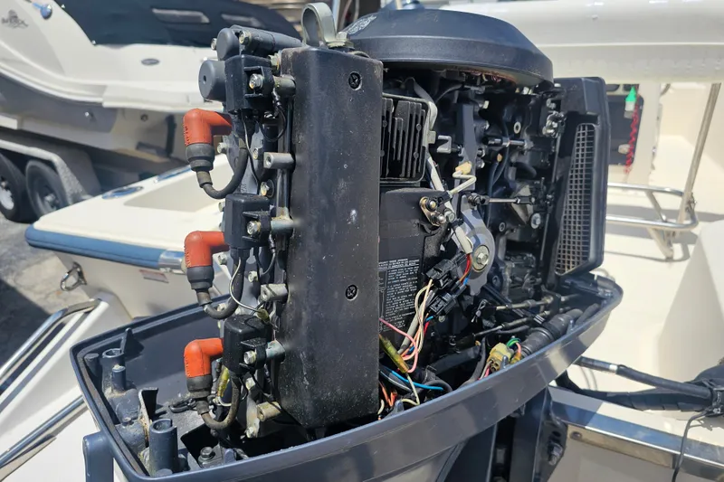 Slide: The Image of Open engine of a 2003 Key West 1720 Sportsman boat, showing internal components. - 20