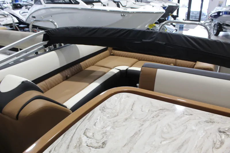 Slide: The Image of 2026 Avalon 2585 25 Catalina ENT boat interior with luxurious seating and elegant table design. - 8