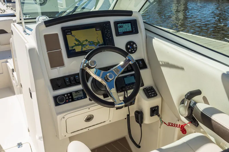 Slide: The Image of Steering console of 2027 Sailfish 245 DC boat with navigation equipment. - 4