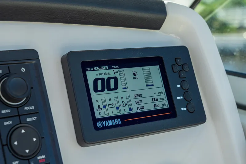 Slide: The Image of Yamaha display on 2027 Sailfish 245 DC boat dashboard, showing fuel and speed metrics. - 6