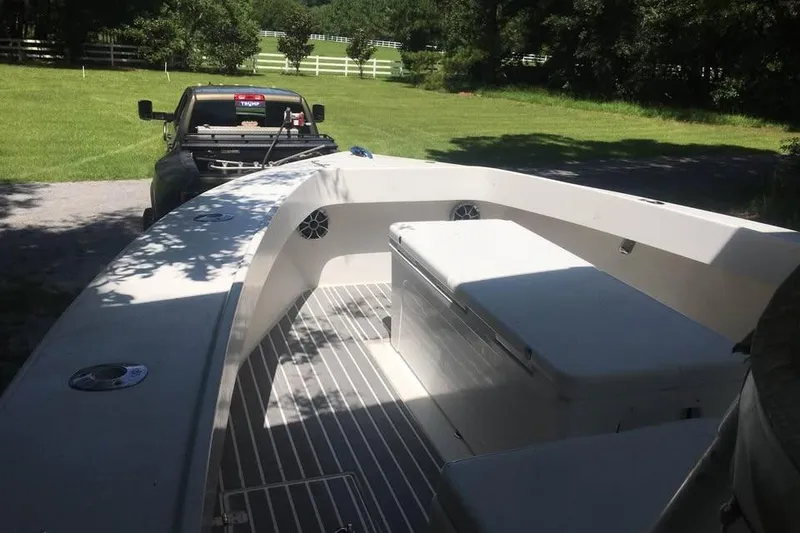 Slide: The Image of 1999 Ocean Master 31 boat on trailer, parked in a sunny yard. - 13