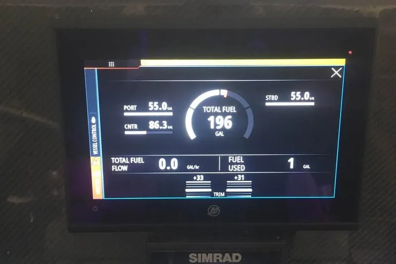 Slide: The Image of Boat fuel gauge display showing 196 gallons total for Ocean Master 31, 1999 model. - 7