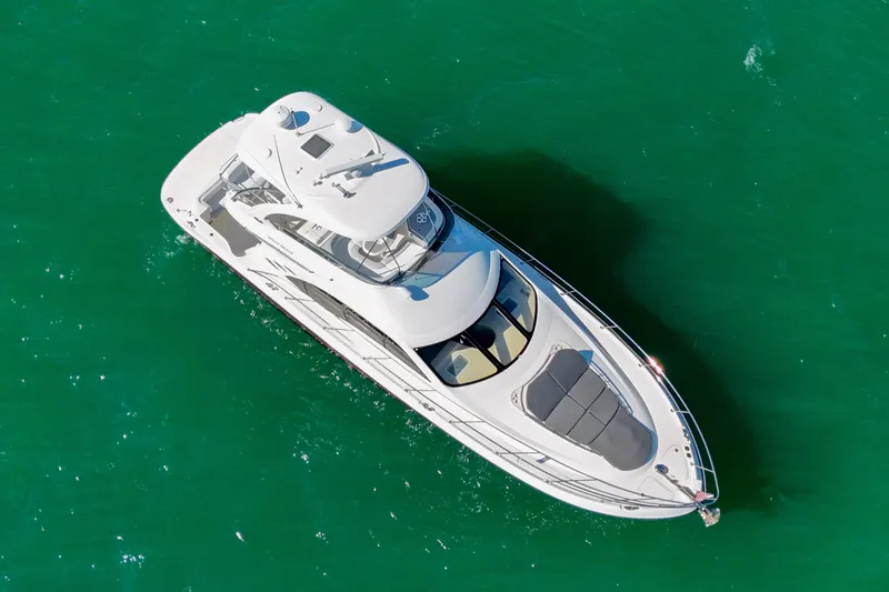 Slide: The Image of Aerial view of 2007 Sea Ray 52 Sedan Bridge yacht on green water. - 22