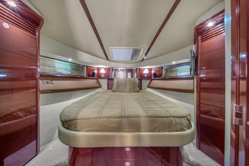 Slide: The Image of Luxurious interior of 2007 Sea Ray 52 Sedan Bridge yacht with elegant wood finishes. - 29