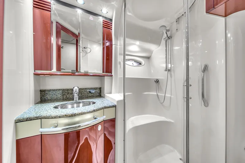 Slide: The Image of Luxurious bathroom in 2007 Sea Ray 52 Sedan Bridge yacht with granite countertop and shower. - 32