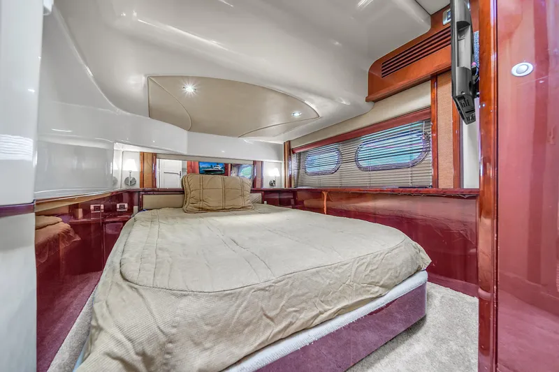 Slide: The Image of Luxurious cabin interior of 2007 Sea Ray 52 Sedan Bridge yacht with cozy bed. - 33