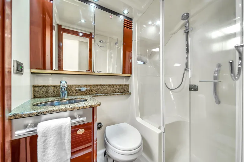 Slide: The Image of Luxurious bathroom in 2007 Sea Ray 52 Sedan Bridge yacht with granite countertop. - 35