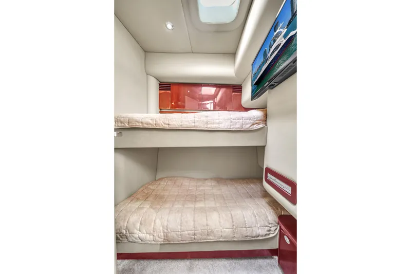 Slide: The Image of Interior of 2007 Sea Ray 52 Sedan Bridge with bunk beds and wall-mounted TV. - 36