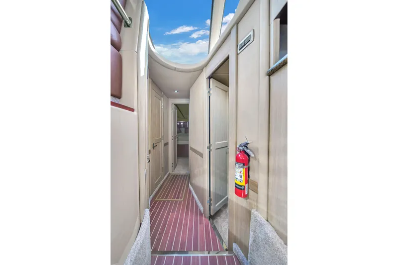 Slide: The Image of Interior hallway of 2007 Sea Ray 52 Sedan Bridge yacht with fire extinguisher. - 37