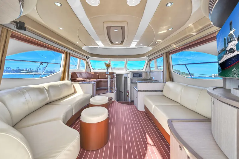 Slide: The Image of Luxurious interior of a 2007 Sea Ray 52 Sedan Bridge yacht with elegant seating and panoramic windows. - 39