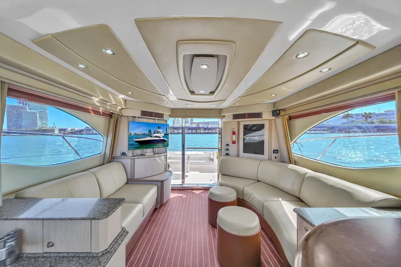 Slide: The Image of Luxurious interior of 2007 Sea Ray 52 Sedan Bridge yacht with panoramic windows and plush seating. - 45