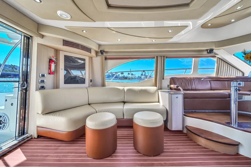 Slide: The Image of Luxurious interior of 2007 Sea Ray 52 Sedan Bridge yacht with elegant seating and panoramic windows. - 47