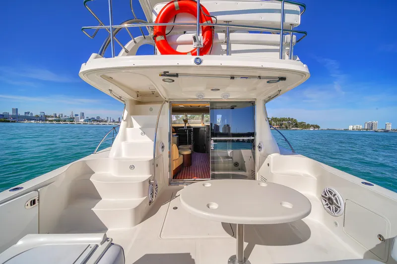 Slide: The Image of 2007 Sea Ray 52 Sedan Bridge yacht with spacious deck and ocean view. - 50