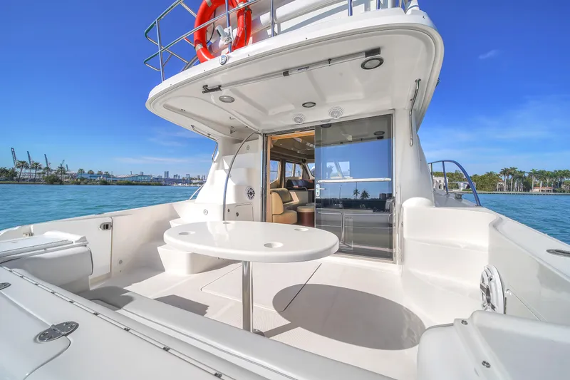 Slide: The Image of 2007 Sea Ray 52 Sedan Bridge yacht with spacious deck and ocean view. - 51