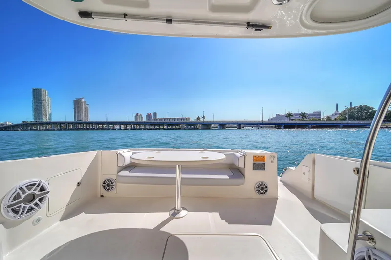 Slide: The Image of 2007 Sea Ray 52 Sedan Bridge yacht with city skyline and bridge view. - 52