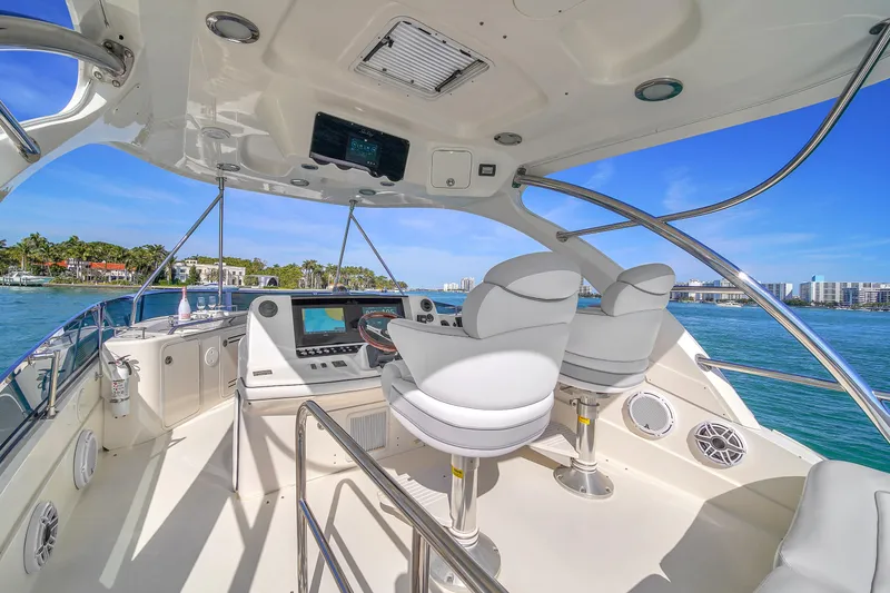Slide: The Image of Luxurious 2007 Sea Ray 52 Sedan Bridge yacht interior with modern helm and ocean view. - 57