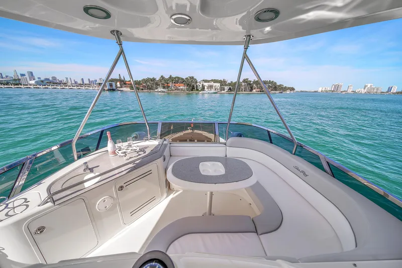 Slide: The Image of Luxurious 2007 Sea Ray 52 Sedan Bridge yacht interior with ocean view and seating area. - 59
