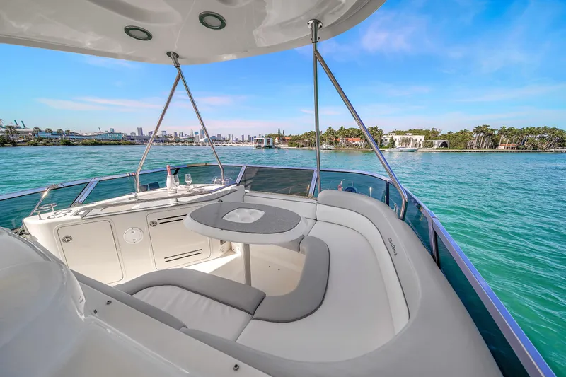 Slide: The Image of Luxurious 2007 Sea Ray 52 Sedan Bridge yacht with scenic waterfront view. - 60