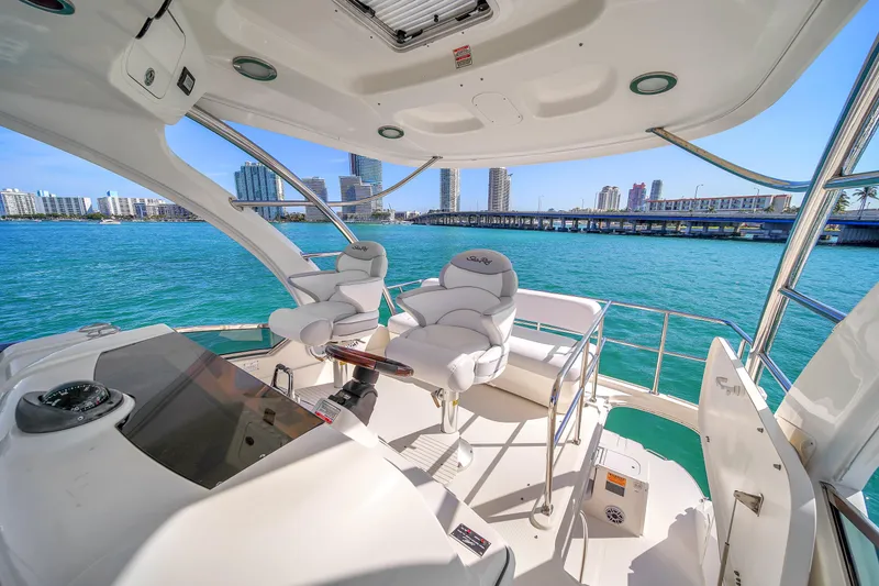 Slide: The Image of Luxurious 2007 Sea Ray 52 Sedan Bridge yacht interior with city skyline view. - 63