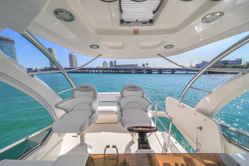 Slide: The Image of 2007 Sea Ray 52 Sedan Bridge yacht interior with city skyline and ocean view. - 64