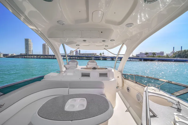 Slide: The Image of Luxurious 2007 Sea Ray 52 Sedan Bridge yacht interior with waterfront cityscape view. - 65