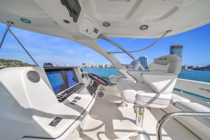 Slide: The Image of Luxurious 2007 Sea Ray 52 Sedan Bridge yacht helm with city skyline view. - 67