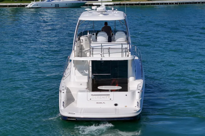 Slide: The Image of 2007 Sea Ray 52 Sedan Bridge yacht cruising in Miami waters. - 7